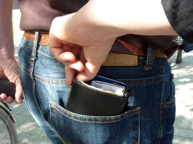 Pickpocket easily taking a wallet from the back pocket