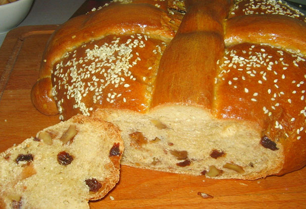 Christopsomo is a Greek festive bread made with orange, cloves, cinnamon and dried fruits