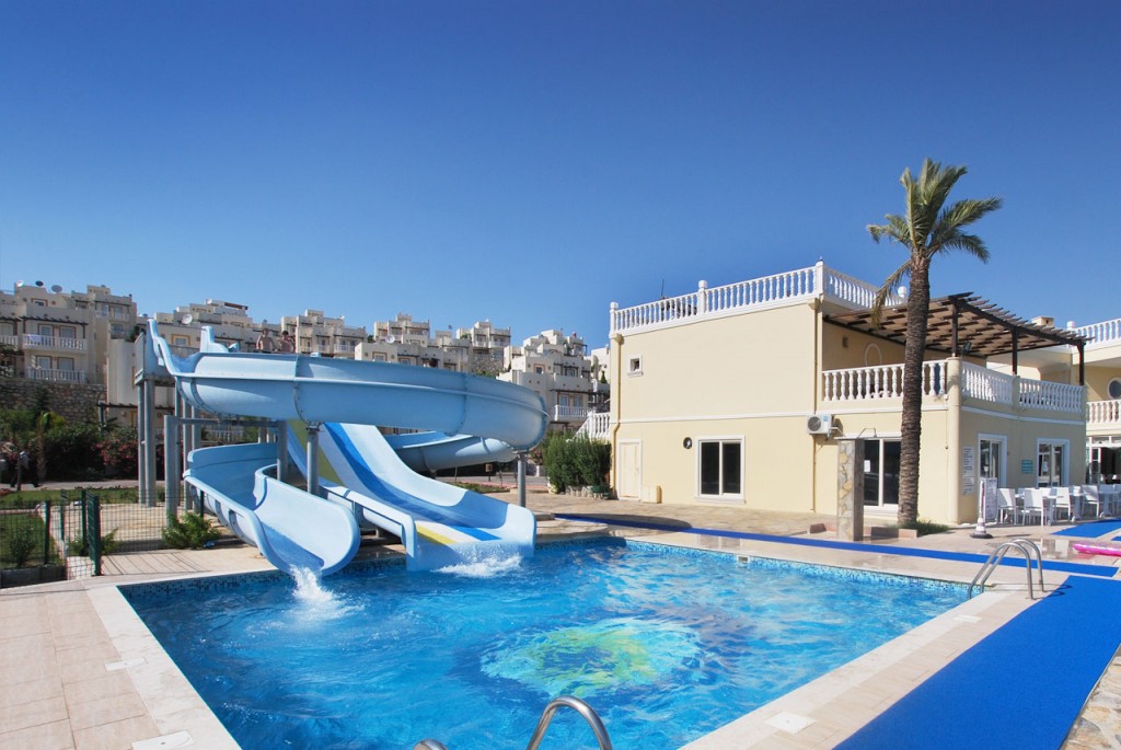 The two waterslides are sited to the side of the main communal pool