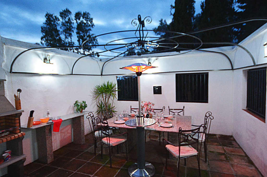 Villa SP004 sheltered outside dining area with BBQ and patio heater