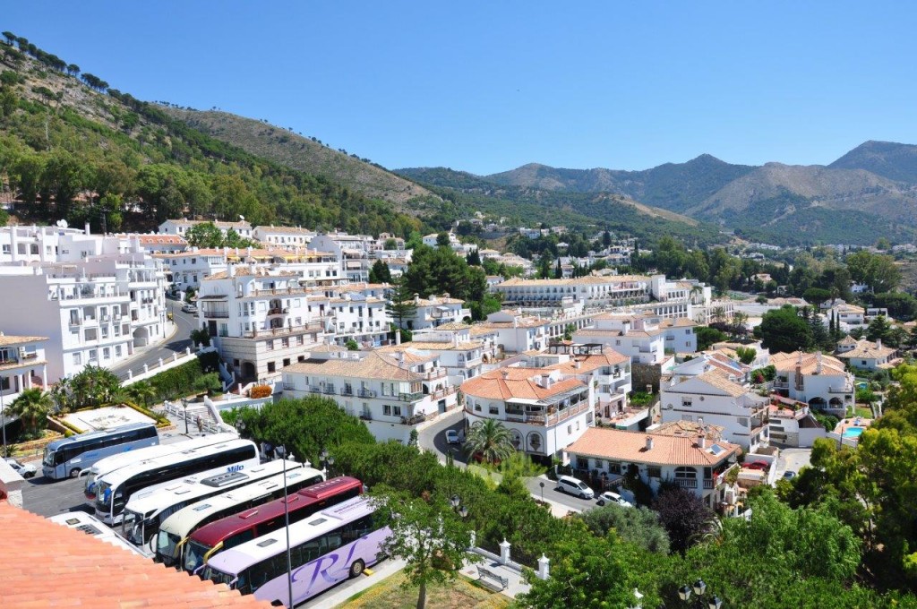 Mijas, showing the stunning mountain backdrop against the hillside and whitewashed houses