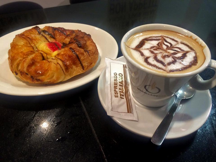 La Costa Café Bar in Los Boliches, shown is a traditional Spanish breakfast with pastry and Italian coffee