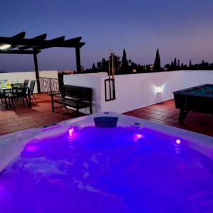 Villa SP001 showing the American style hot tub illuminated at night