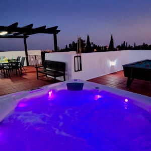 Villa SP001 showing the American style hot tub illuminated at night